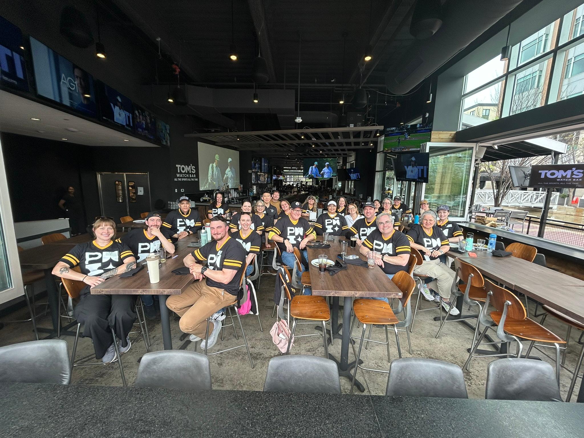 PMI Pittsburgh Volunteers taking a much needed break in their Stillers-themed PMI shirts